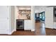 Bar area with shelves, wood countertop and built-in beverage refrigerator at 5643 S Fulton Way, Greenwood Village, CO 80111