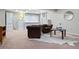 Finished basement showcasing an open living space, built-in shelving and comfortable seating at 5643 S Fulton Way, Greenwood Village, CO 80111