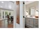 Beautiful bathroom with gray vanity, decorative fixtures, and updated finishes at 5643 S Fulton Way, Greenwood Village, CO 80111