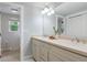 Bright bathroom featuring dual sinks, modern fixtures, and an open layout at 5643 S Fulton Way, Greenwood Village, CO 80111