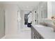 Well-lit bathroom with shower and views into the walk-in closet at 5643 S Fulton Way, Greenwood Village, CO 80111