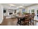 Open-concept living area with fireplace, hardwood floors, and natural light at 5643 S Fulton Way, Greenwood Village, CO 80111