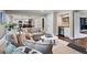 Open concept living area leading to dining area, kitchen, and wet bar at 5643 S Fulton Way, Greenwood Village, CO 80111