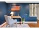 Cozy office space with a desk, chair, and American flag art at 5643 S Fulton Way, Greenwood Village, CO 80111