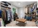 Spacious walk-in closet with custom shelving and organized storage solutions at 5643 S Fulton Way, Greenwood Village, CO 80111