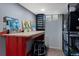 Functional basement workshop, complete with workbench, shelving, and a small window at 5643 S Fulton Way, Greenwood Village, CO 80111