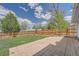 Fenced backyard offering both patio space and grassy area, perfect for outdoor living at 17731 E Bails Pl, Aurora, CO 80017