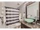 Updated bathroom with modern fixtures, tile accent wall, and unique vessel sink at 17731 E Bails Pl, Aurora, CO 80017