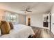 Bright bedroom with dark wood floors and access to the bathroom and walk in closet at 17731 E Bails Pl, Aurora, CO 80017