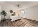 Cozy bedroom featuring dark wood floors, a decorative rug and a ceiling fan at 17731 E Bails Pl, Aurora, CO 80017