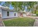 Charming home featuring well-maintained landscaping, wood accents, and a beautifully manicured green lawn at 17731 E Bails Pl, Aurora, CO 80017