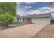 Charming single-story home with blue siding, brick accents, a well-maintained lawn, and an attached two-car garage at 17731 E Bails Pl, Aurora, CO 80017