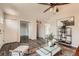 Bright living room with hardwood floors, neutral paint, modern furniture, and an open floor plan at 17731 E Bails Pl, Aurora, CO 80017