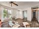 Bright and airy living room featuring wood floors, large windows, and a welcoming atmosphere at 17731 E Bails Pl, Aurora, CO 80017