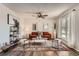 Comfortable living room with an area rug, sofa, ceiling fan, and natural light at 17731 E Bails Pl, Aurora, CO 80017