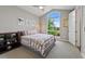 Bright bedroom features a vaulted ceiling, carpet floors, and large window at 5608 Raintree Dr, Parker, CO 80134