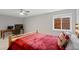 Cozy bedroom with rustic wood accents, comfortable bed, and ample natural light at 5608 Raintree Dr, Parker, CO 80134