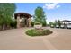 Upscale clubhouse entrance with stone details, covered entryway, and a roundabout at 5608 Raintree Dr, Parker, CO 80134