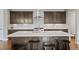 Kitchen with center island, dark cabinetry, granite countertops, and stainless steel appliances at 5608 Raintree Dr, Parker, CO 80134
