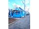 Charming blue home featuring a welcoming front porch, and a well-maintained yard at 924 W 9Th Ave, Denver, CO 80204