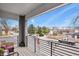 Balcony with an expansive street view, black railings, and outdoor seating at 4205 E Iliff Ave # 5, Denver, CO 80222