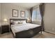 Relaxing bedroom features a cozy bed, soft lighting, and modern decor for a peaceful retreat at 4205 E Iliff Ave # 5, Denver, CO 80222