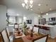 Dining room flows into the kitchen and living room, great for hosting dinner parties at 4205 E Iliff Ave # 5, Denver, CO 80222