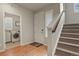 Inviting entryway with a staircase, hardwood floors, and access to the laundry room at 4205 E Iliff Ave # 5, Denver, CO 80222