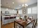 Modern kitchen flows into the dining room with ample counter space for cooking and entertaining guests at 4205 E Iliff Ave # 5, Denver, CO 80222