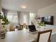 Open-concept living area showcasing a bright interior with an adjacent stairway and contemporary accents at 4205 E Iliff Ave # 5, Denver, CO 80222