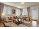 Inviting living room with plentiful natural light, neutral tones, and stylish furnishings at 4205 E Iliff Ave # 5, Denver, CO 80222