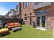 Backyard has an artificial lawn, outdoor seating, and a stone exterior at 105 Fillmore St # 209, Denver, CO 80206
