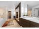 Bathroom featuring a large vanity area and a separate bathtub and walk-in closet at 105 Fillmore St # 209, Denver, CO 80206