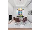Dining area with fireplace, modern furnishings and unique light fixture at 105 Fillmore St # 209, Denver, CO 80206