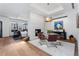 Elegant dining area with a modern chandelier and artwork, perfect for entertaining at 105 Fillmore St # 209, Denver, CO 80206