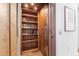 An elevator with wooden interiors and built-in bookshelves combines convenience and style at 105 Fillmore St # 209, Denver, CO 80206