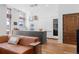 A modern kitchen boasts stainless steel appliances, a wine cooler, sleek cabinets, and opens to the living area at 105 Fillmore St # 209, Denver, CO 80206