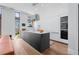Stylish kitchen with a large island, sleek cabinets, and modern appliances at 105 Fillmore St # 209, Denver, CO 80206