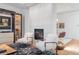 Bright living room featuring stylish furniture and a cozy fireplace at 105 Fillmore St # 209, Denver, CO 80206