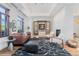 Spacious living room with fireplace, modern furnishings and unique decor at 105 Fillmore St # 209, Denver, CO 80206