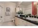 Bathroom with light wood vanity, stone countertops, modern fixtures and neutral paint at 5677 S Park Pl # C111, Englewood, CO 80111