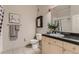 Bathroom featuring a vanity with a black countertop, framed mirror and modern fixtures at 5677 S Park Pl # C111, Englewood, CO 80111