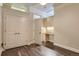 Bedroom with hardwood floors, and an office nook with built-in cabinets and a desk at 5677 S Park Pl # C111, Englewood, CO 80111