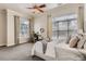 Bright bedroom featuring large windows, plush bedding, and stylish decor for a relaxing and inviting space at 5677 S Park Pl # C111, Englewood, CO 80111