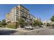 Exterior shot of an apartment building with balconies and parking at 5677 S Park Pl # C111, Englewood, CO 80111