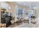 Inviting living space with a fireplace, comfortable seating, a large window, and an adjacent dining area at 5677 S Park Pl # C111, Englewood, CO 80111