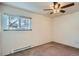 Bedroom features carpeting, one window, and a ceiling fan at 6021 Yarrow St # B13, Arvada, CO 80004