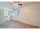 Bright bedroom featuring a spacious closet and neutral carpeting at 6021 Yarrow St # B13, Arvada, CO 80004