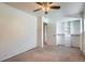 Neutral bedroom with carpet, a ceiling fan and an installed closet organizer at 6021 Yarrow St # B13, Arvada, CO 80004