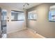 A dining room with tile floors, light gray walls, and natural light from the windows at 6021 Yarrow St # B13, Arvada, CO 80004